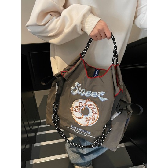 The Ball Chain doughnut embroidered shopping bag with the same style as the Internet celebrity is a fashionable large-capacity hand-held bag and shoulder tote bag