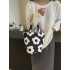 A small floral canvas bag, a large white bucket for women on Instagram, a baby bag, and a handbag for mom to go out to work and commute