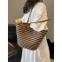 The 2025 summer new straw-woven women's bag is fashionable, versatile, and has a large capacity. It is a single-shoulder bag for classes and commuting